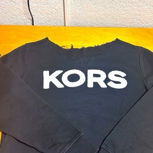 Over size MK sweater. Relaxed fit. Very cute off the shoulder